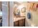 Nautical-themed bathroom features a vanity with granite counters and attractive decorative touches at 731 Laurel Bay Cir, New Smyrna Beach, FL 32169