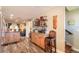 Open kitchen area with bar seating and stainless steel fridge, flowing into a comfortable living space at 731 Laurel Bay Cir, New Smyrna Beach, FL 32169