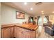 The open-concept space includes a wooden bar and dining area, seamlessly connected to the living room at 731 Laurel Bay Cir, New Smyrna Beach, FL 32169