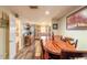 The dining area features a wooden table and flows to the kitchen area in the house at 731 Laurel Bay Cir, New Smyrna Beach, FL 32169