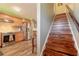 Kitchen with stainless steel appliances and stairs with wood treads to upper level at 731 Laurel Bay Cir, New Smyrna Beach, FL 32169