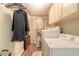 Functional laundry room with a washer, dryer, storage cabinets, and room for folding at 731 Laurel Bay Cir, New Smyrna Beach, FL 32169