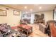 Spacious living area with wood floors and a wet bar is ideal for entertaining guests at 731 Laurel Bay Cir, New Smyrna Beach, FL 32169