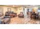 Bright living room flows into the kitchen and features wood floors and comfortable seating at 731 Laurel Bay Cir, New Smyrna Beach, FL 32169