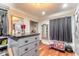 A well-organized walk-in closet with built-in storage, hardwood floors, and decorative accents at 731 Laurel Bay Cir, New Smyrna Beach, FL 32169