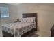 Comfortable bedroom features a wood bed frame with a plush, patterned comforter and matching dresser at 808 Catherine Ave, Daytona Beach, FL 32117