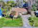 Aerial view of house with driveway and landscaping at 103 Sea St, New Smyrna Beach, FL 32168