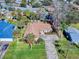 Aerial view of house with driveway and landscaping at 103 Sea St, New Smyrna Beach, FL 32168