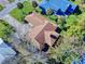 Aerial view of a house with brown roof and spacious yard at 103 Sea St, New Smyrna Beach, FL 32168