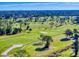 Aerial view of lush green golf course at 103 Sea St, New Smyrna Beach, FL 32168