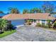 Aerial view of house with large yard and white garage door at 103 Sea St, New Smyrna Beach, FL 32168