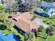 Single-story home with brown roof and surrounding landscaping at 103 Sea St, New Smyrna Beach, FL 32168