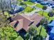 Single-story home with brown roof and surrounding landscaping at 103 Sea St, New Smyrna Beach, FL 32168