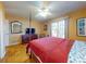 Spacious bedroom with hardwood floors and large windows at 103 Sea St, New Smyrna Beach, FL 32168