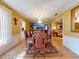 Formal dining room with hardwood floors, chandelier, and large artwork at 103 Sea St, New Smyrna Beach, FL 32168