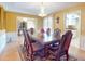 Elegant dining room with a large table and chandelier at 103 Sea St, New Smyrna Beach, FL 32168