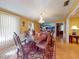 Formal dining room with hardwood floors, chandelier, and large artwork at 103 Sea St, New Smyrna Beach, FL 32168