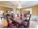 Bright dining room with a view of the living room and fireplace at 103 Sea St, New Smyrna Beach, FL 32168