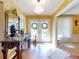 Bright entryway with hardwood floors, ornate console table, and chandelier at 103 Sea St, New Smyrna Beach, FL 32168