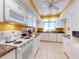 Bright kitchen with white appliances and granite countertops at 103 Sea St, New Smyrna Beach, FL 32168