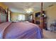 Main bedroom with a large wooden post bed and a fireplace at 103 Sea St, New Smyrna Beach, FL 32168