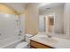 Full bathroom with tub, shower, vanity, and mirror at 104 Kelly Thomas Way, Daytona Beach, FL 32124