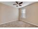 Bright bedroom with ceiling fan and large window at 104 Kelly Thomas Way, Daytona Beach, FL 32124