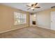 Bright bedroom with ceiling fan and access to bathroom at 104 Kelly Thomas Way, Daytona Beach, FL 32124