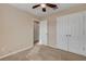 Bedroom with ceiling fan, closet, and access to bathroom at 104 Kelly Thomas Way, Daytona Beach, FL 32124