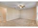 Spacious bedroom with ceiling fan and neutral color scheme at 104 Kelly Thomas Way, Daytona Beach, FL 32124