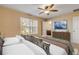 Spacious bedroom with ensuite bathroom and large window at 104 Kelly Thomas Way, Daytona Beach, FL 32124