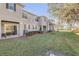 Exterior view of building with green lawn and trees at 104 Kelly Thomas Way, Daytona Beach, FL 32124