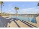 Community pool with lounge chairs and lake view at 104 Kelly Thomas Way, Daytona Beach, FL 32124