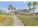 Community pool area with cabana and palm trees at 104 Kelly Thomas Way, Daytona Beach, FL 32124