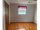 Hardwood floor bedroom with window and closet at 109 Western Ave, Edgewater, FL 32132