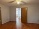 Spacious bedroom with hardwood floors and an open doorway at 109 Western Ave, Edgewater, FL 32132