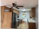 Bright kitchen with stainless steel appliances and wood cabinets at 109 Western Ave, Edgewater, FL 32132