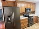 Modern kitchen with updated appliances and wood cabinets at 109 Western Ave, Edgewater, FL 32132