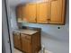 Laundry room with wood cabinets and countertop at 109 Western Ave, Edgewater, FL 32132