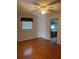 Bright living room featuring hardwood floors and a view into the kitchen at 109 Western Ave, Edgewater, FL 32132