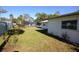 Large backyard with grassy area and partial view of a fence at 1120 Marcel St, New Smyrna Beach, FL 32168