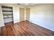 Bedroom with wood floors and built-in shelving at 1120 Marcel St, New Smyrna Beach, FL 32168