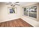 Bright bedroom with laminate wood floors and multiple windows at 1120 Marcel St, New Smyrna Beach, FL 32168