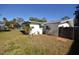 Side view of a single story home with a fenced yard at 1120 Marcel St, New Smyrna Beach, FL 32168