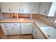 Bright kitchen features ample counter space and white cabinets at 1120 Marcel St, New Smyrna Beach, FL 32168