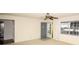 Bright living room with a ceiling fan and view of the front door at 1120 Marcel St, New Smyrna Beach, FL 32168