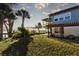 Waterfront backyard with pergola and lush grass at 1324 N Peninsula Ave, New Smyrna Beach, FL 32169