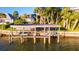 Elevated boat lift with wooden decking and support beams at 1324 N Peninsula Ave, New Smyrna Beach, FL 32169