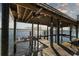 Wooden boat lift on a covered dock at 1324 N Peninsula Ave, New Smyrna Beach, FL 32169