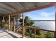 Covered porch with tranquil river and nature views at 1324 N Peninsula Ave, New Smyrna Beach, FL 32169